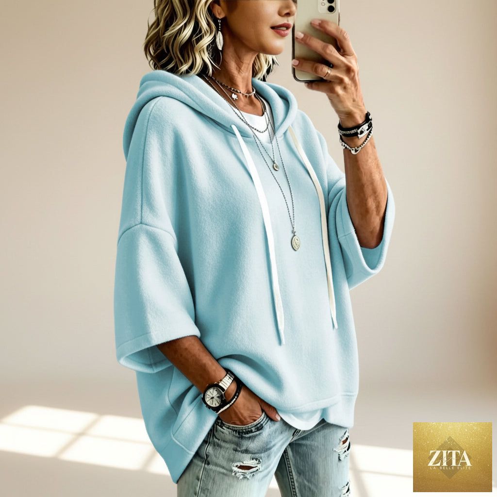 Women's oversized batwing sleeve hoodie by FitiqueFit featuring a loose fleece pullover with a relaxed fit and cozy design.