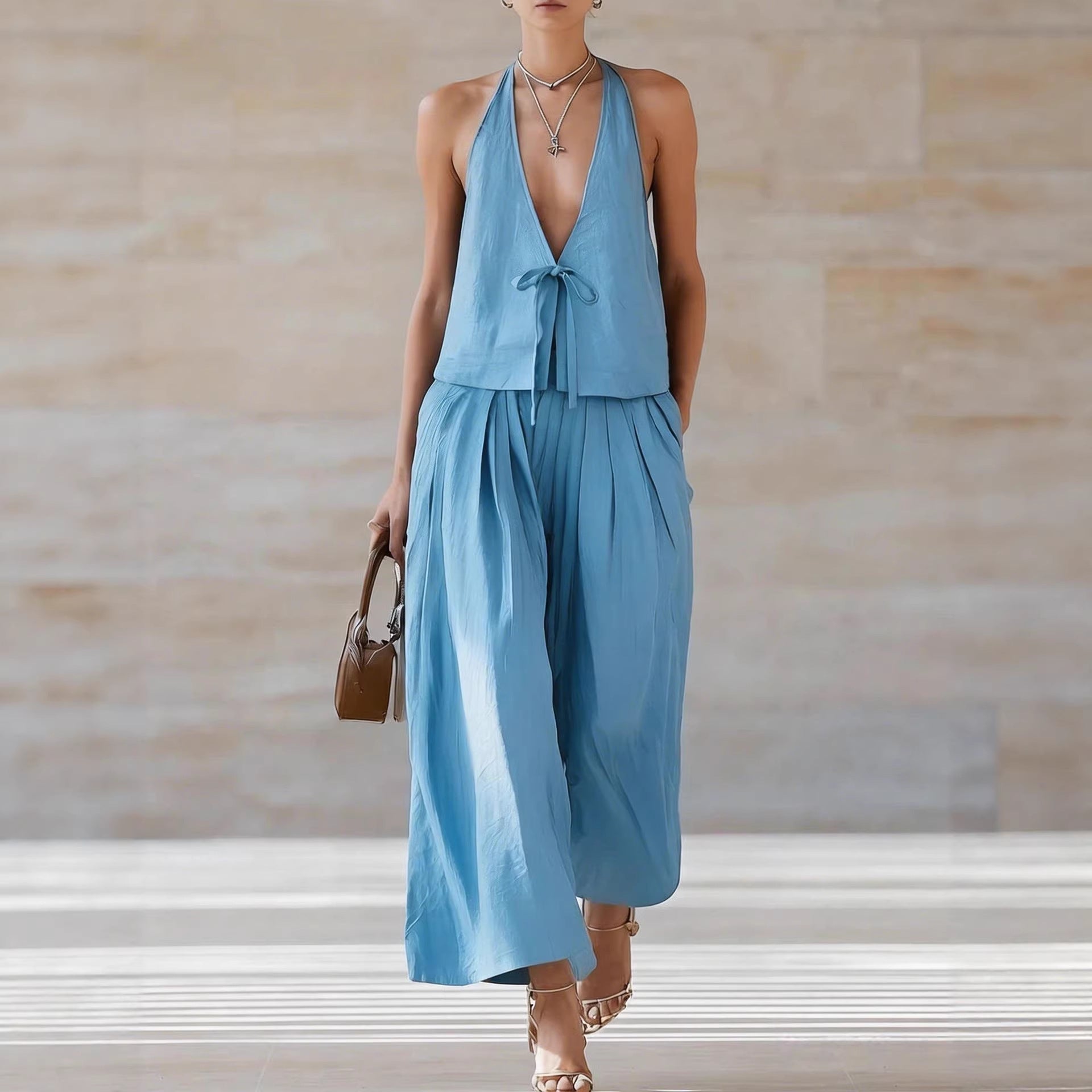Women's sleeveless vest and wide-leg pants casualwear set by FitiqueFit, featuring lace-up details in a stylish, comfortable design.