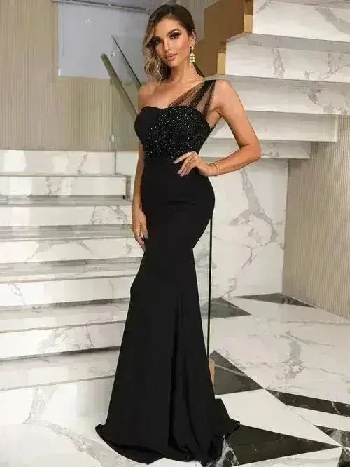 Femstylo rhinestone one-shoulder formal evening gown for women with elegant, sparkling design and flowing fabric.