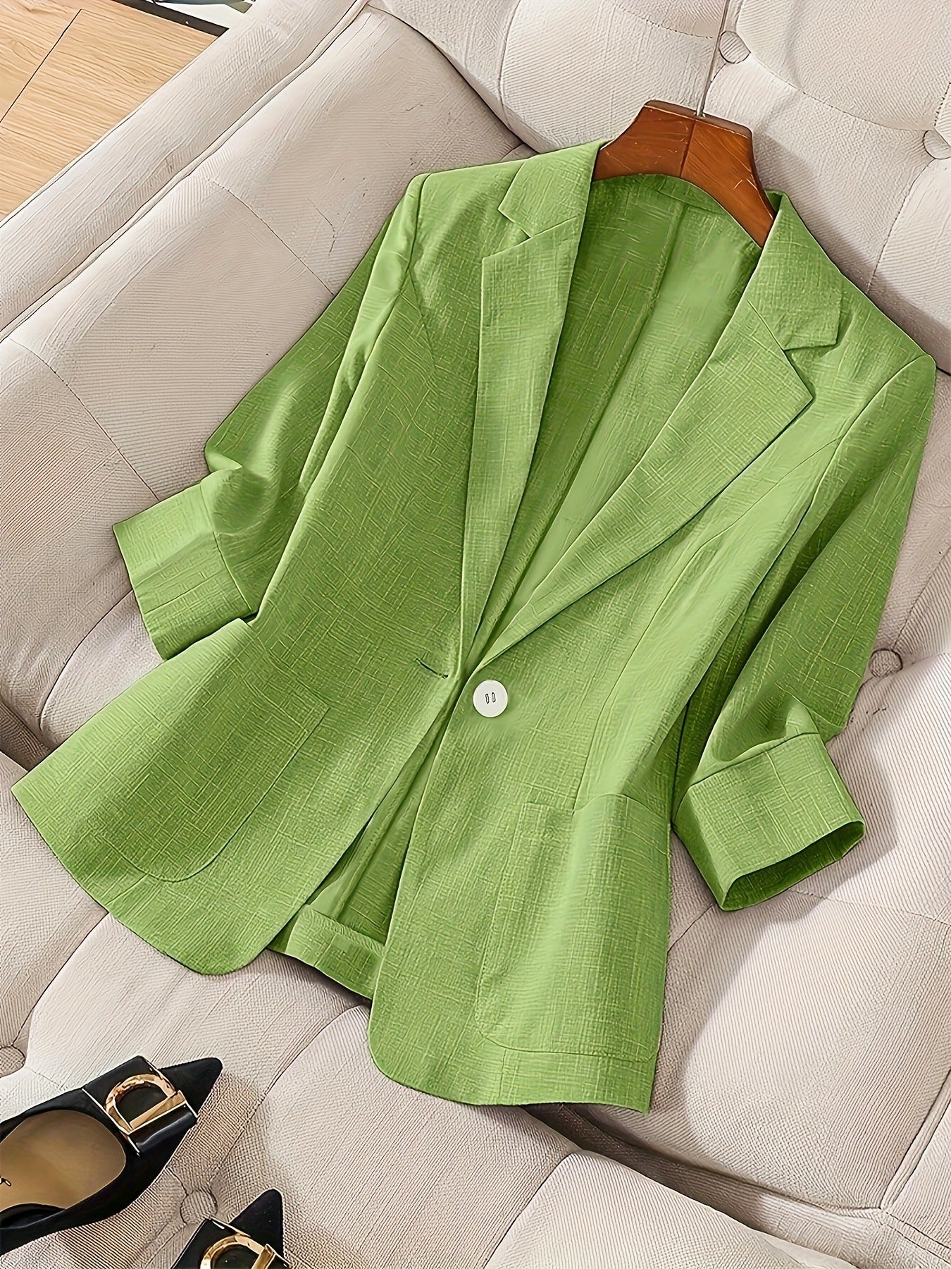 Women's casual blazer with three-quarter sleeves and single button closure by FitiqueFit, shown on a mannequin.