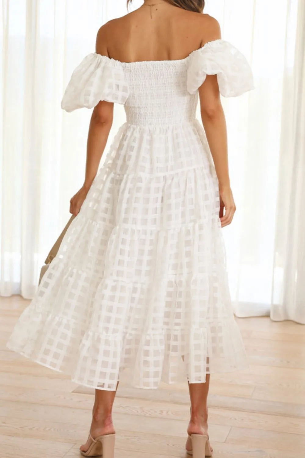 Off shoulder short puff sleeve midi dress by Shopiebay, featuring a stylish, feminine design with a fitted waist and flowing skirt.