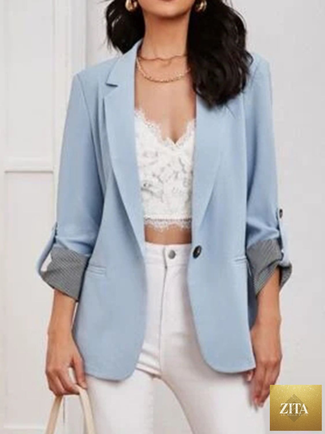 SITRA blazer with lapel collar, roll-tab sleeves, tailored fit, in a classic style, shown on a neutral background.