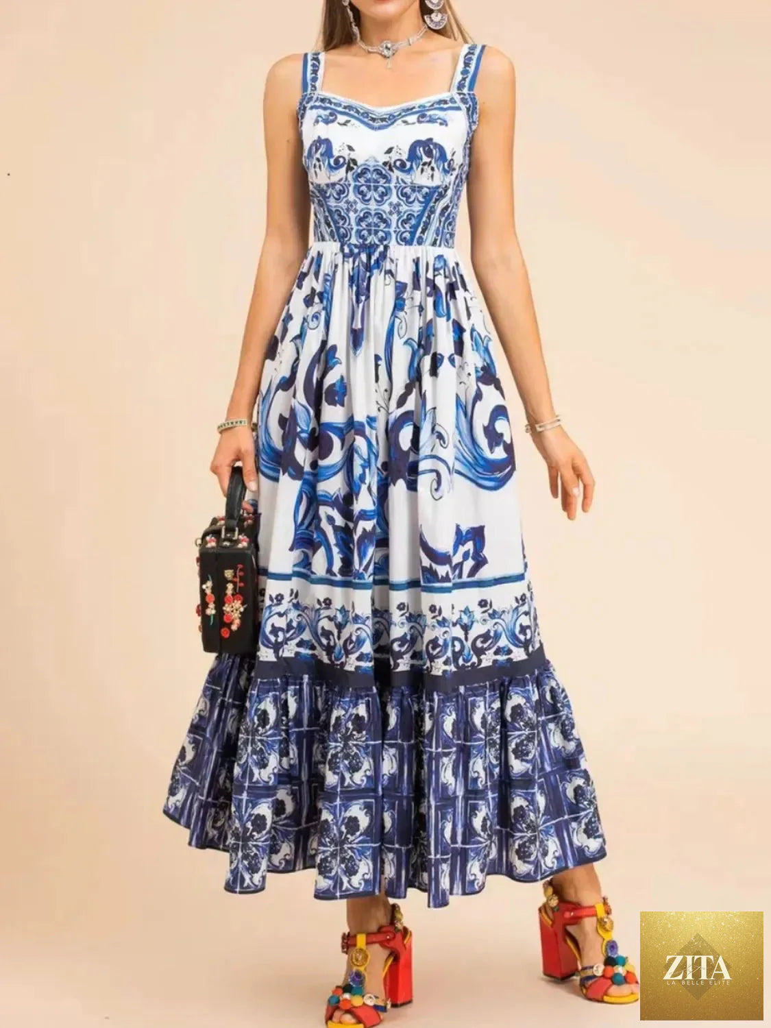 Smocked printed wide strap dress by Shopiebay with floral pattern, featuring a fitted bodice and flowing skirt, perfect for summer wear.