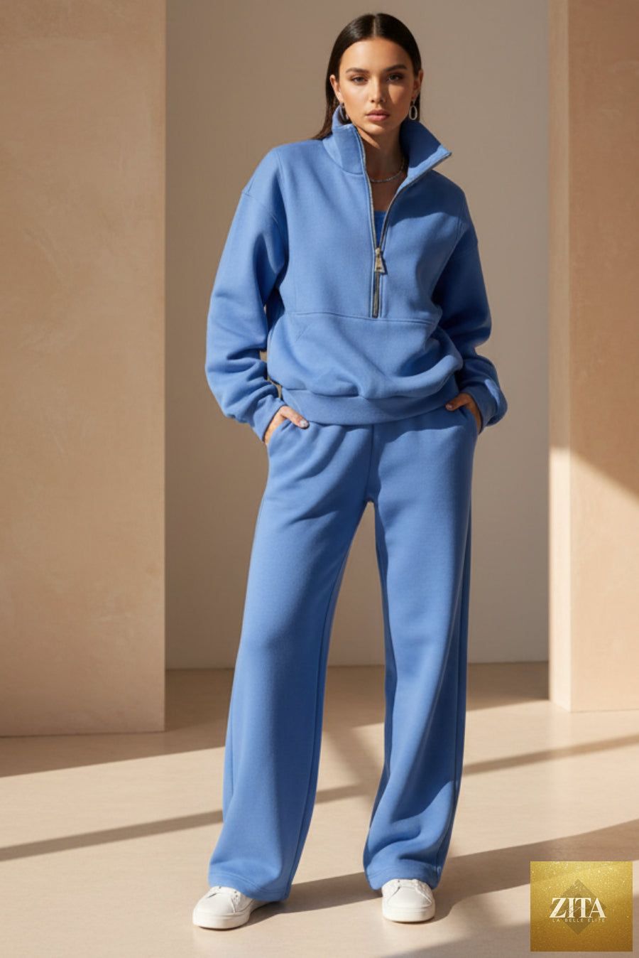 Women's MERIDGE fleece two-piece set with a full-zip cropped sweatshirt and wide-leg pants, shown in a cozy, casual style.