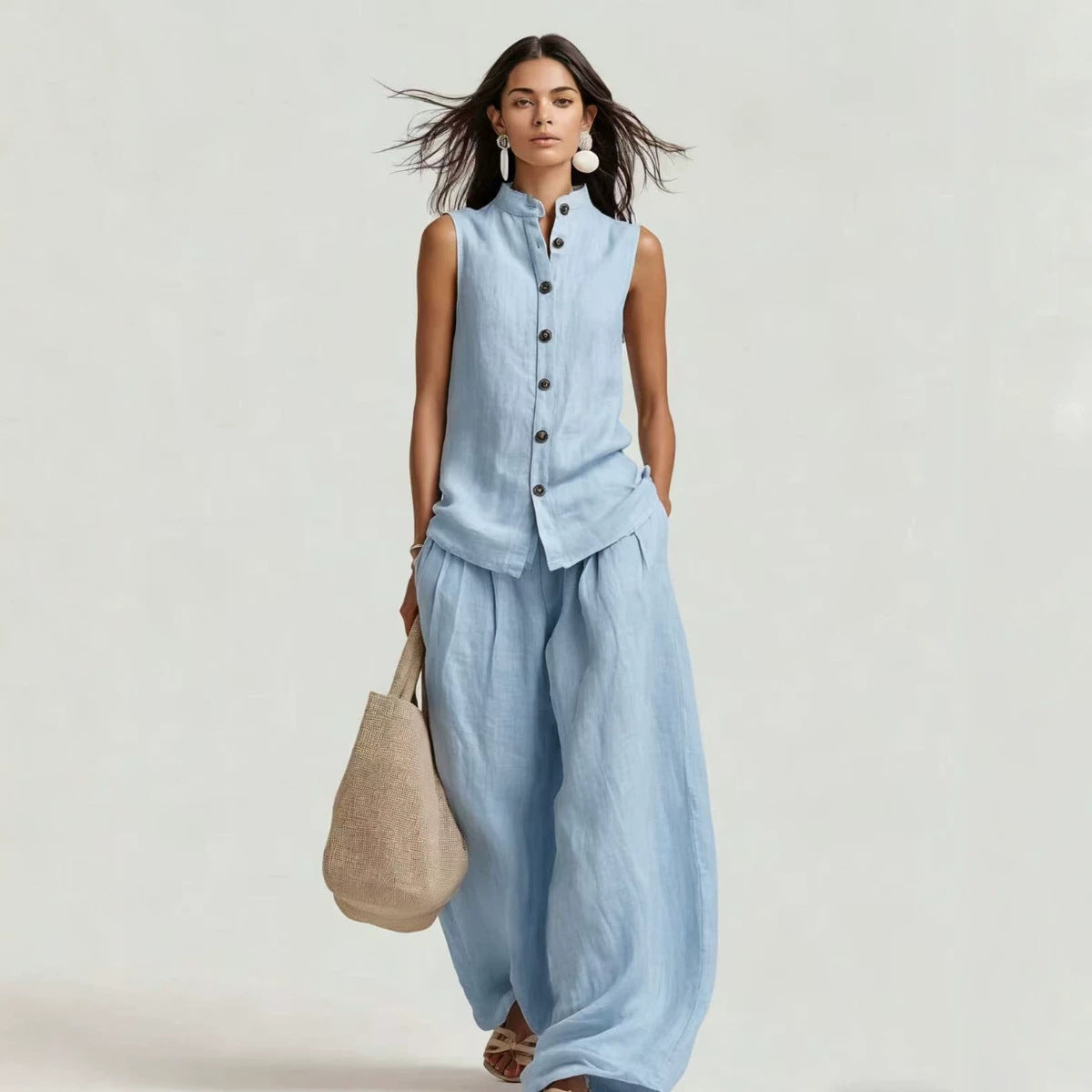 Women's casualwear set by FitiqueFit featuring a stand collar sleeveless top and high-waist wide-leg pants, stylish and comfortable.