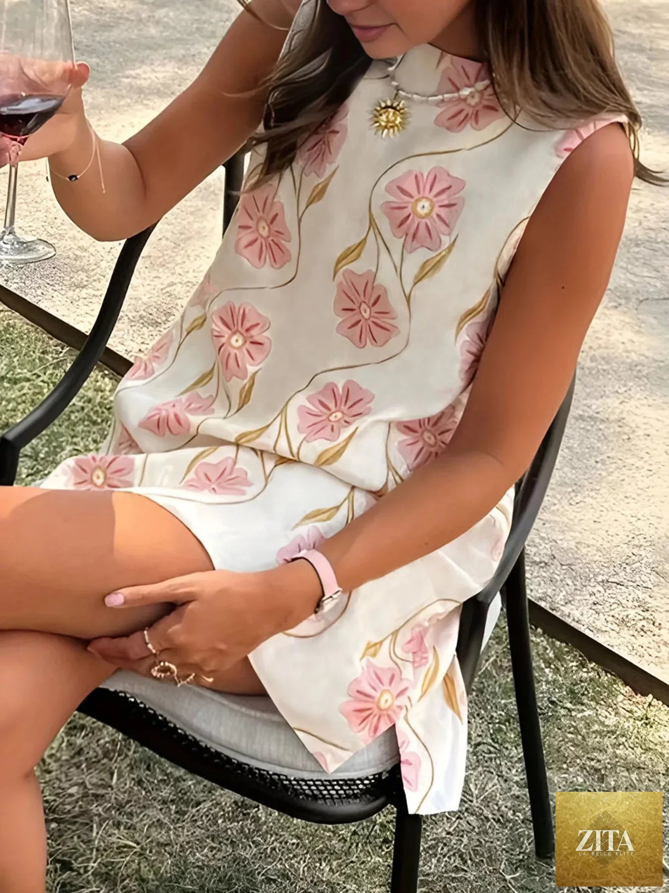 Floral pattern sleeveless mini dress by Shopiebay featuring a vibrant floral print and a fitted bodice.