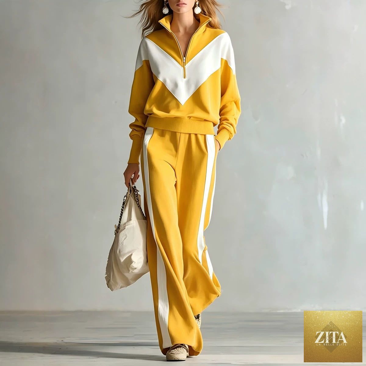 Women's colour-block chevron half-zip sweatshirt and wide-leg side-stripe tracksuit set by MERIDGE, showing bold color contrasts and relaxed fit.