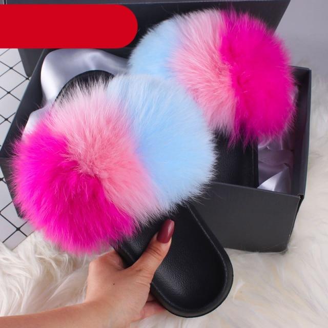 Stevvex women's indoor fur slippers featuring plush fluffy open-toe slides with fox fur and feather accents for cozy comfort.