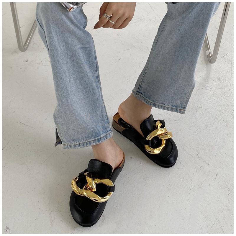 Stevvex women's slip-on slippers with metal chain design, closed round toe, low heels, casual flat slides, gold chain detail.