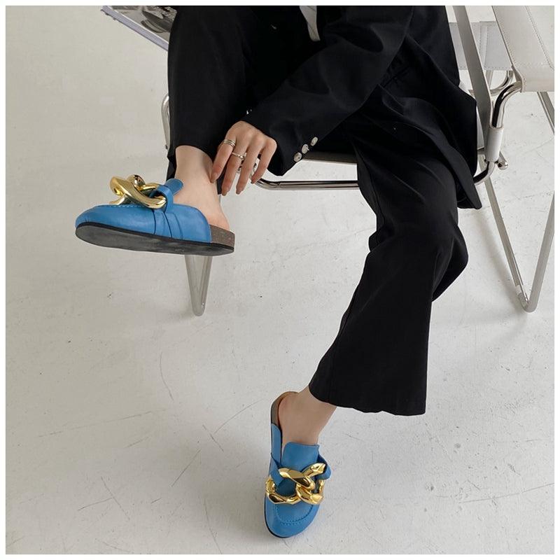 Stevvex women's closed-toe slip-on flats with gold chain detail, round toe, low heels, casual slide sandals, and loafer style.