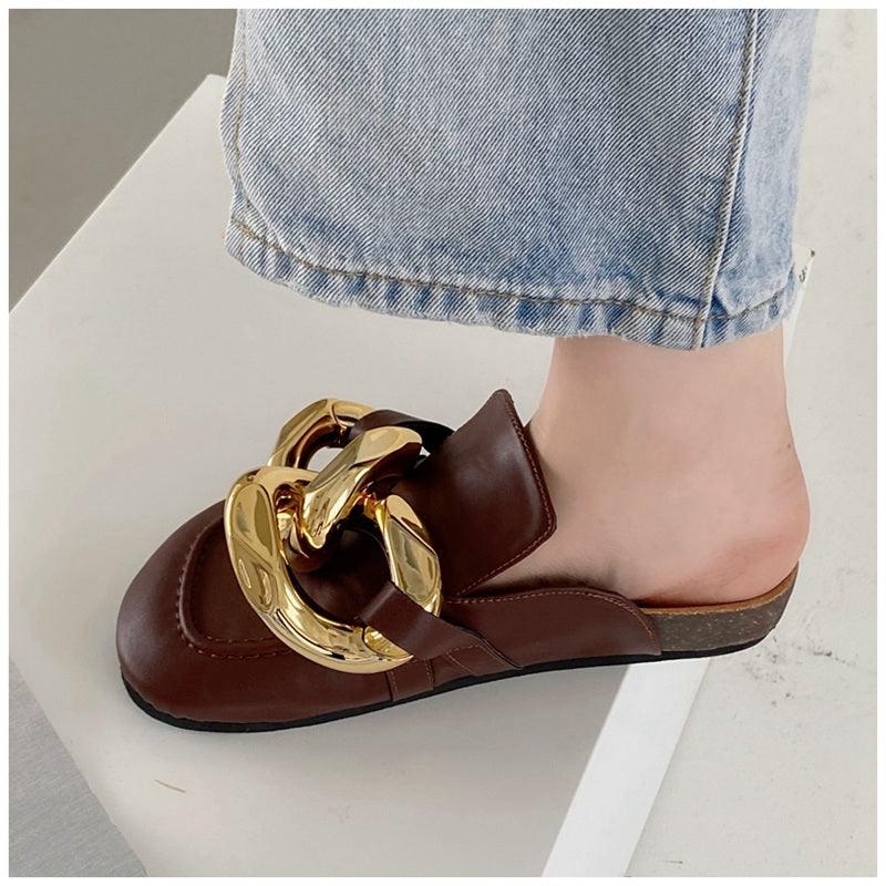 Stevvex women's slip-on slippers with metal chain design, closed round toe, low heels, casual flat slides with gold accents.