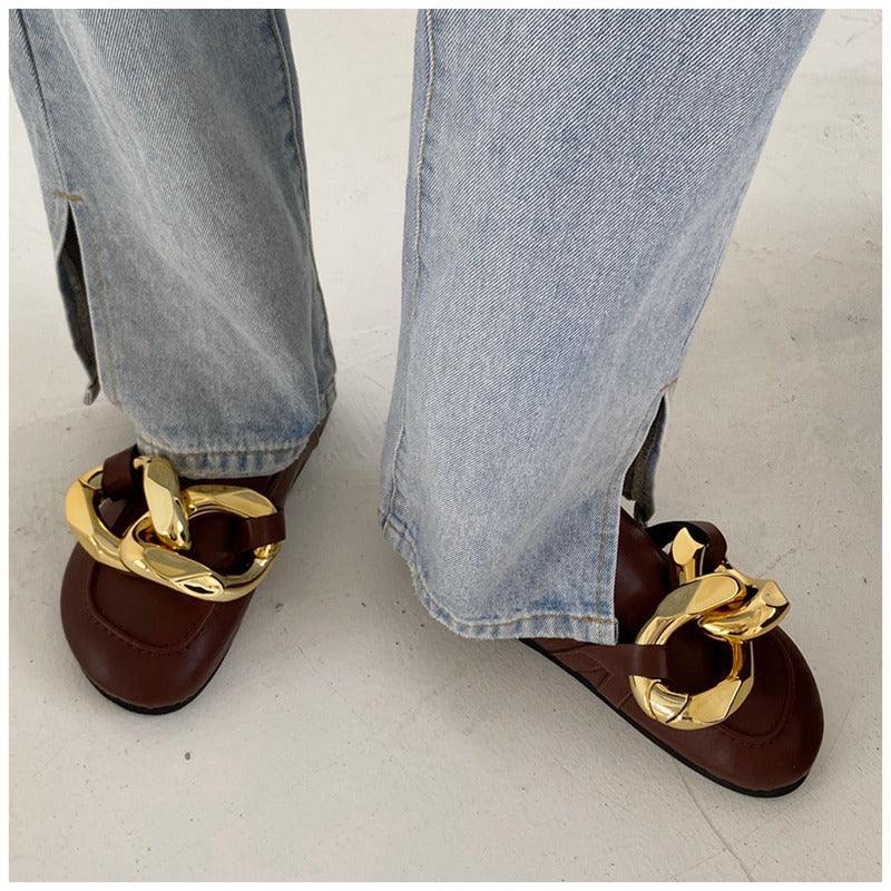 Stevvex women's slip-on casual slides with metal chain detail, closed round toe, low heels, and gold accents.