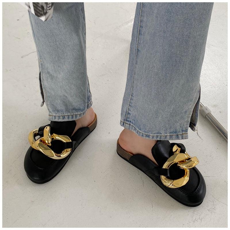 Stevvex women's slip-on slide sandals with a gold chain, closed round toe, low heels, casual flat loafer style.