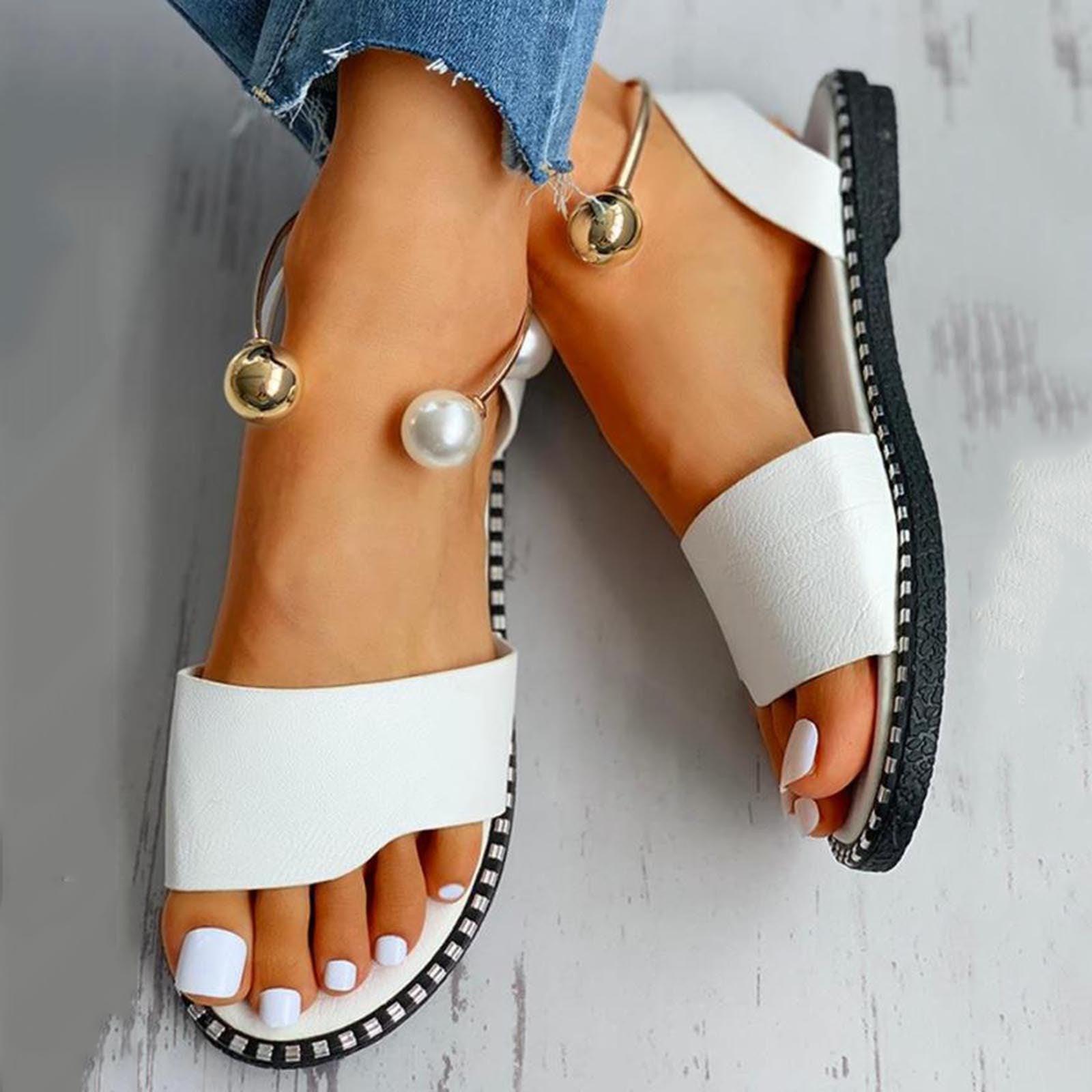 White women's fashion sandals with pearl buckle, round toe, strappy design, non-slip sole, suitable for casual or wedding wear.