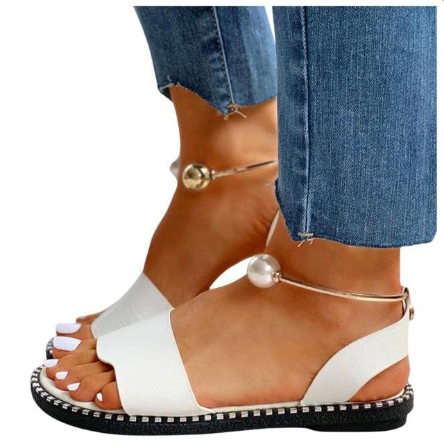 Stevvex white women's fashion sandals with pearl buckle, round toe, strappy design, non-slip sole, perfect for summer and outdoor wear.
