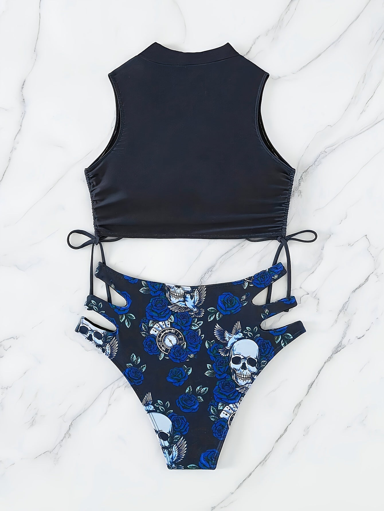 Stevvex bikini set with skull print and floral lace-up design, featuring high stretch fabric and a hollow-out style for summer beach wear.