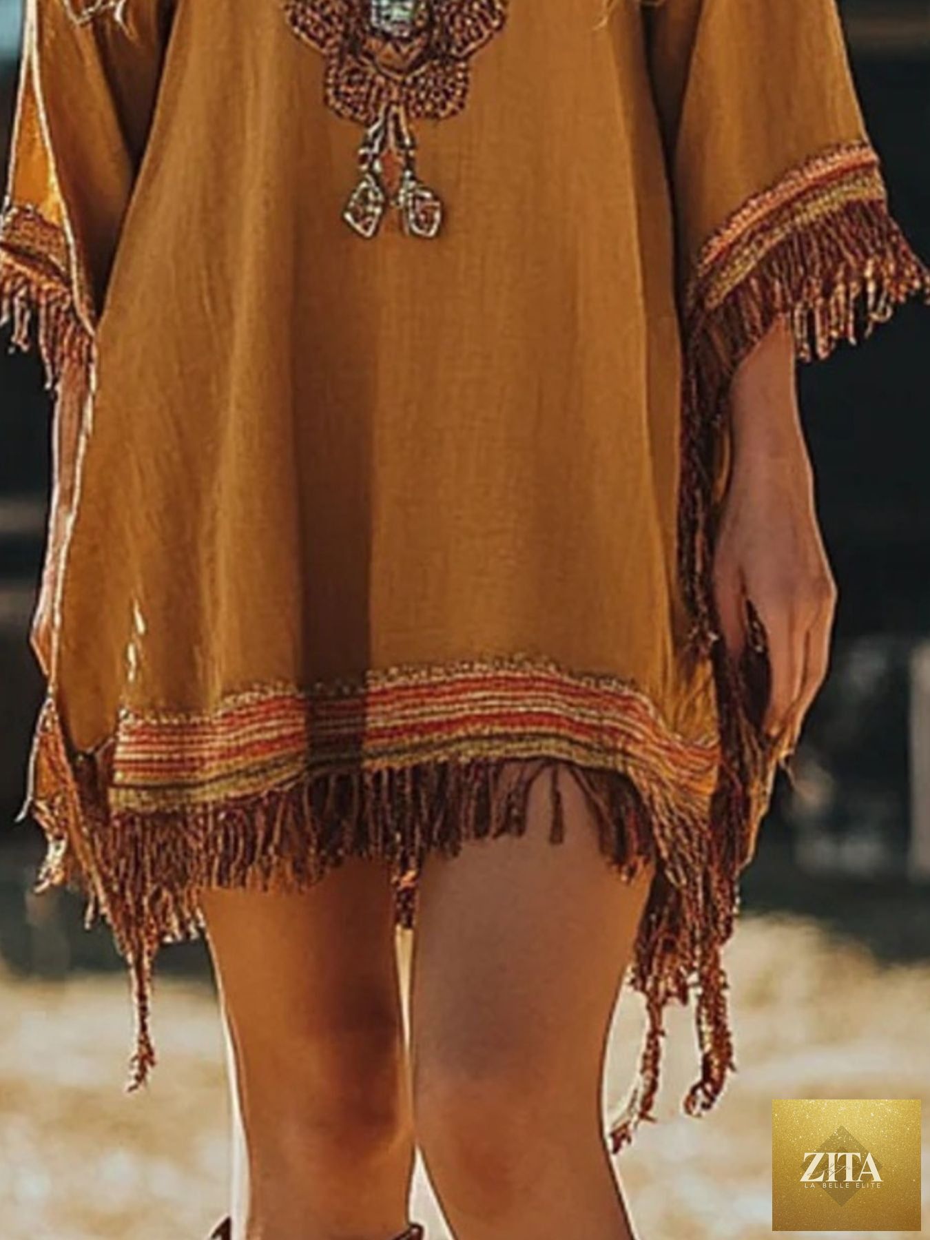 Shopiebay fringe hem 3/4 sleeve mini dress showing a stylish dress with fringe detail and a comfortable fit, perfect for casual wear