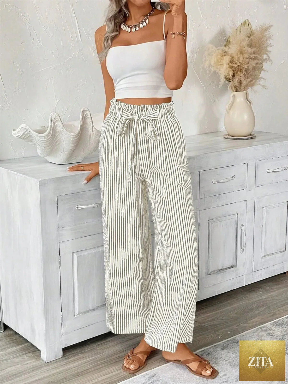 Plus size SITRA striped wide leg paper bag pants with a high waist and relaxed fit, shown in a full-length view.