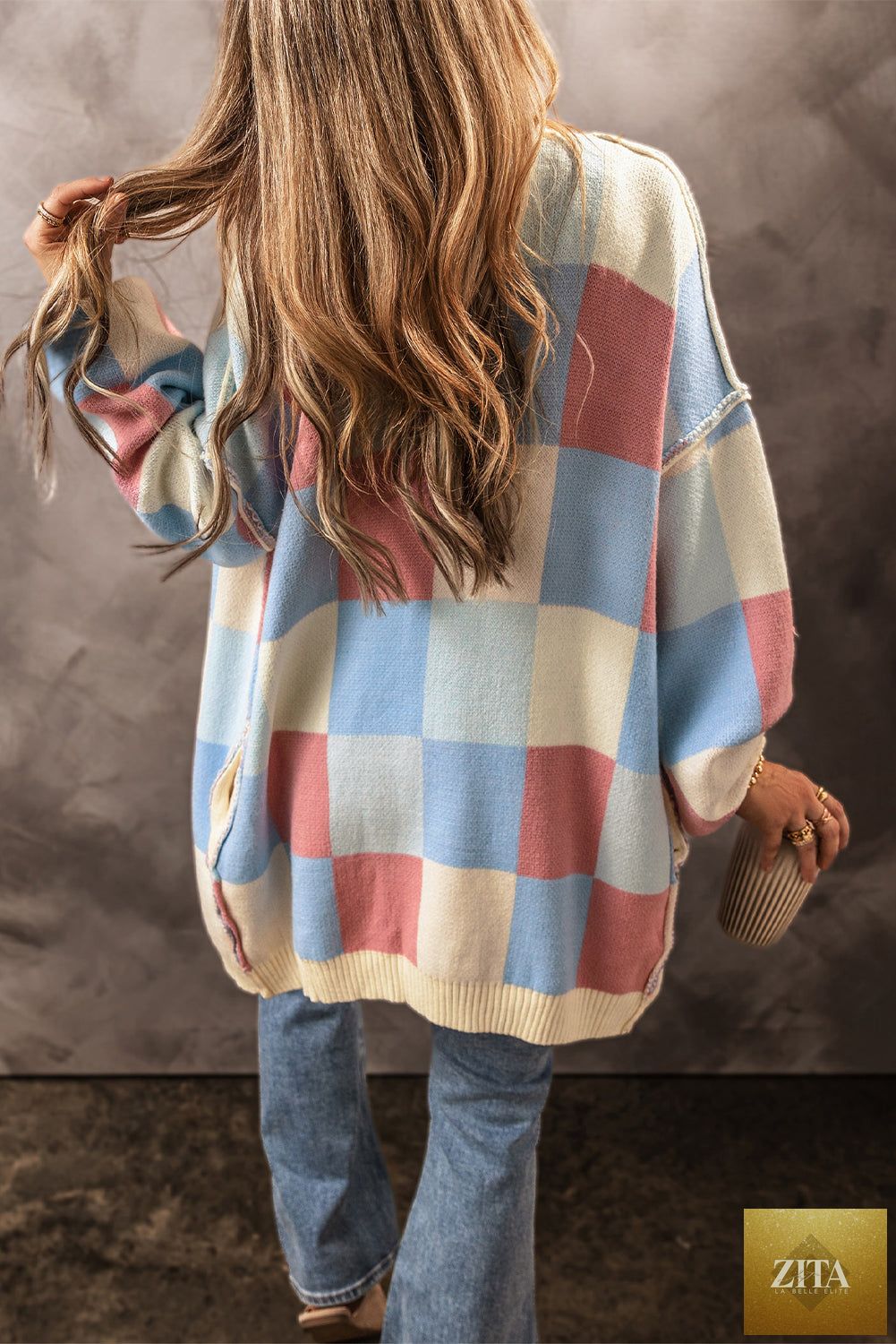 Light blue checkered open front cardigan with drop shoulders and exposed seams, from Unique Oils, perfect for casual layering.