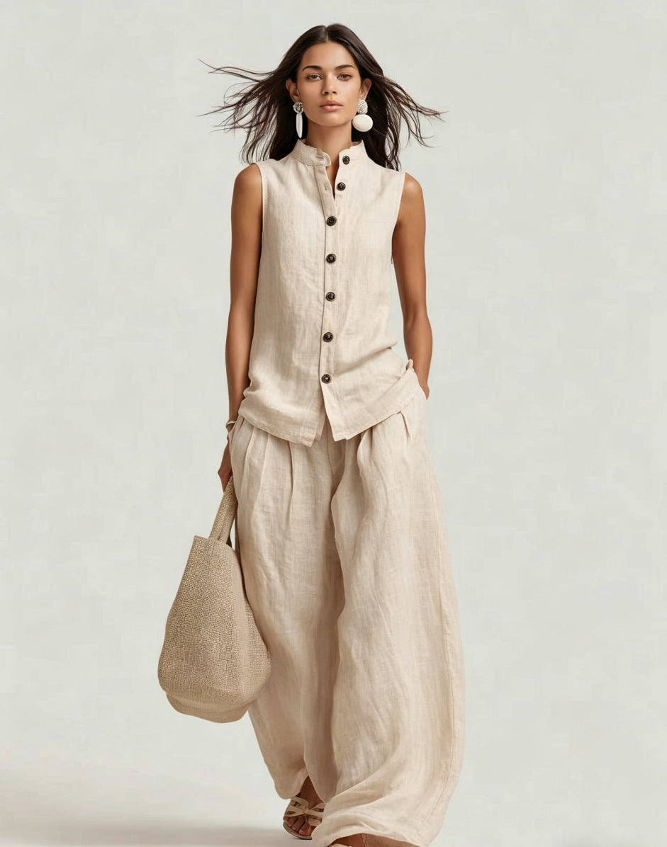 Women's sleeveless stand collar top and high-waist wide-leg pants set by FitiqueFit, casualwear ensemble, front view.