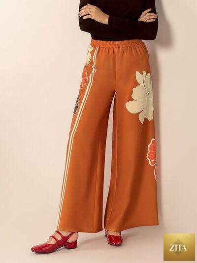 Printed elastic waist wide leg pants by Selvanelle featuring a relaxed fit and comfortable style, shown in a full-length view.