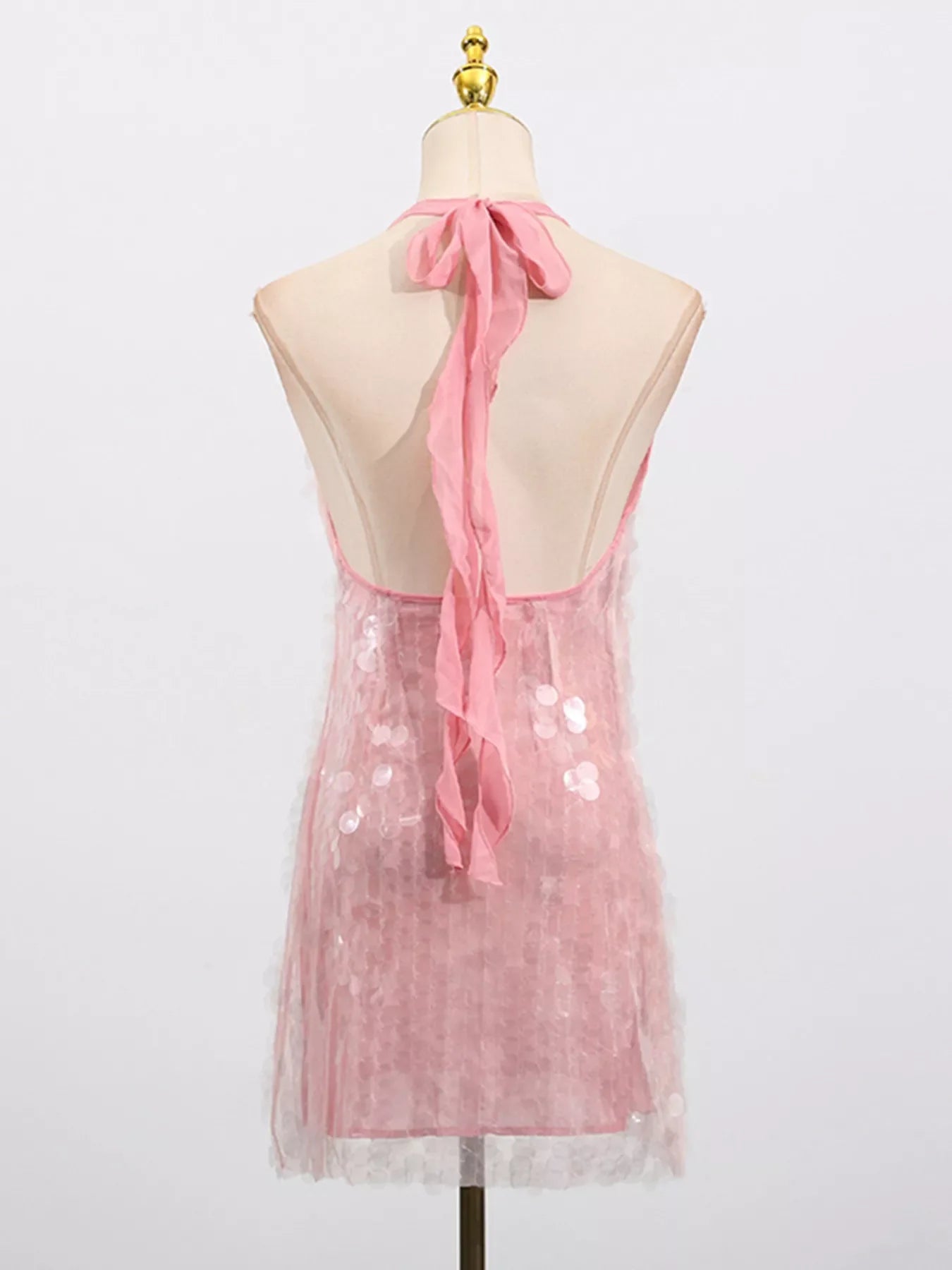 Sequin halter neck mini dress by Shopiebay featuring shimmering sequins and a fitted silhouette, perfect for evening wear.