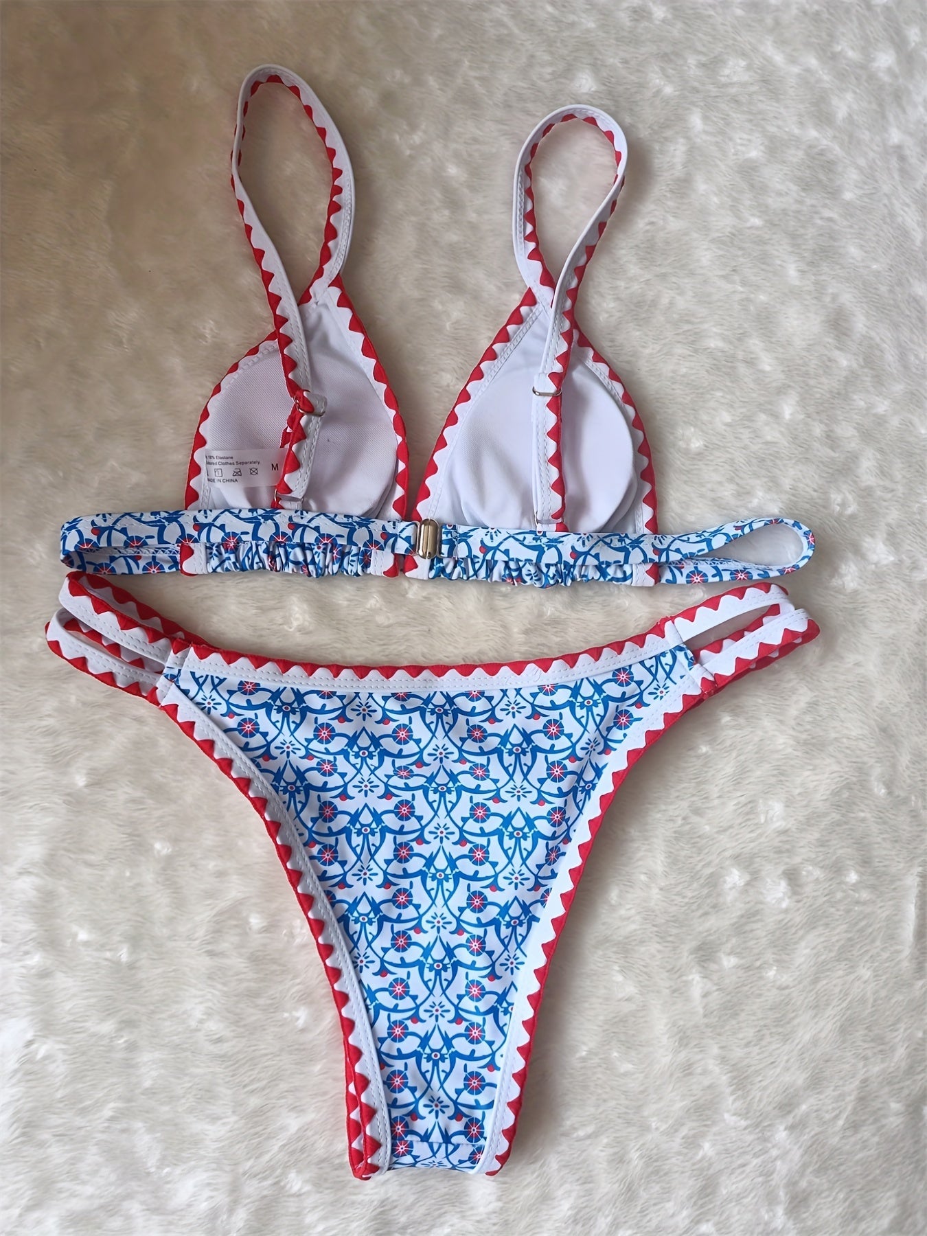 Stevvex Blossom Charm high-cut bikini set with floral print, embroidered cut-out top, contrast trim, and back buckle for summer beachwear.