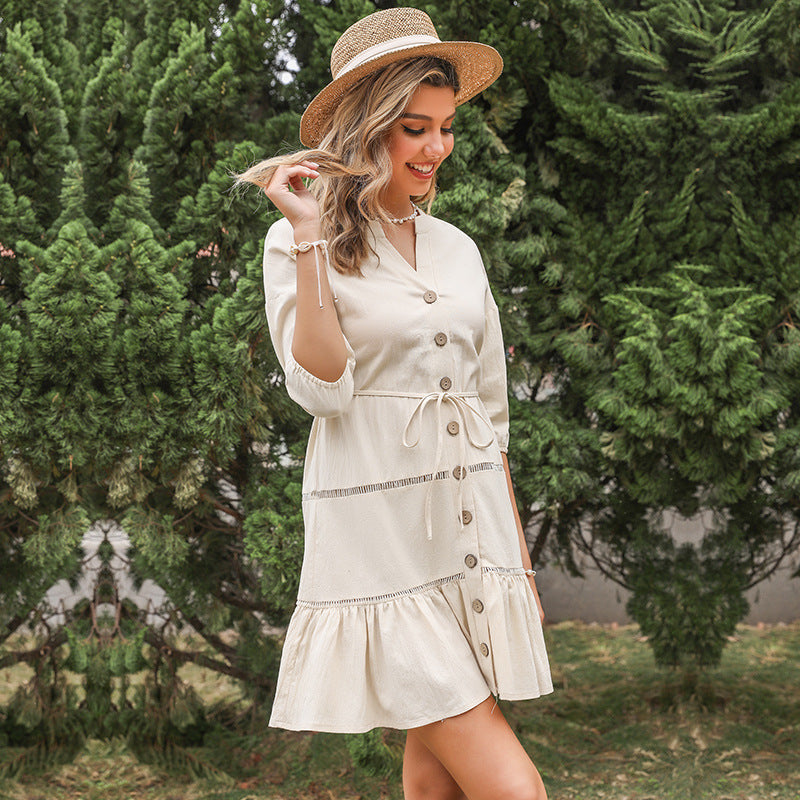 Women's V-Neck A-Line Dress by FitiqueFit with three-quarter sleeves and contrast panel, shown hanging on a mannequin.