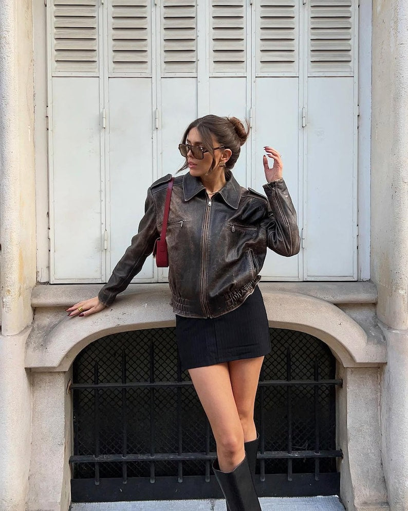 Vintage 90s oversized black leather bomber jacket by Cows Skin Jackets, distressed real leather, Parisian street style women's outerwear.
