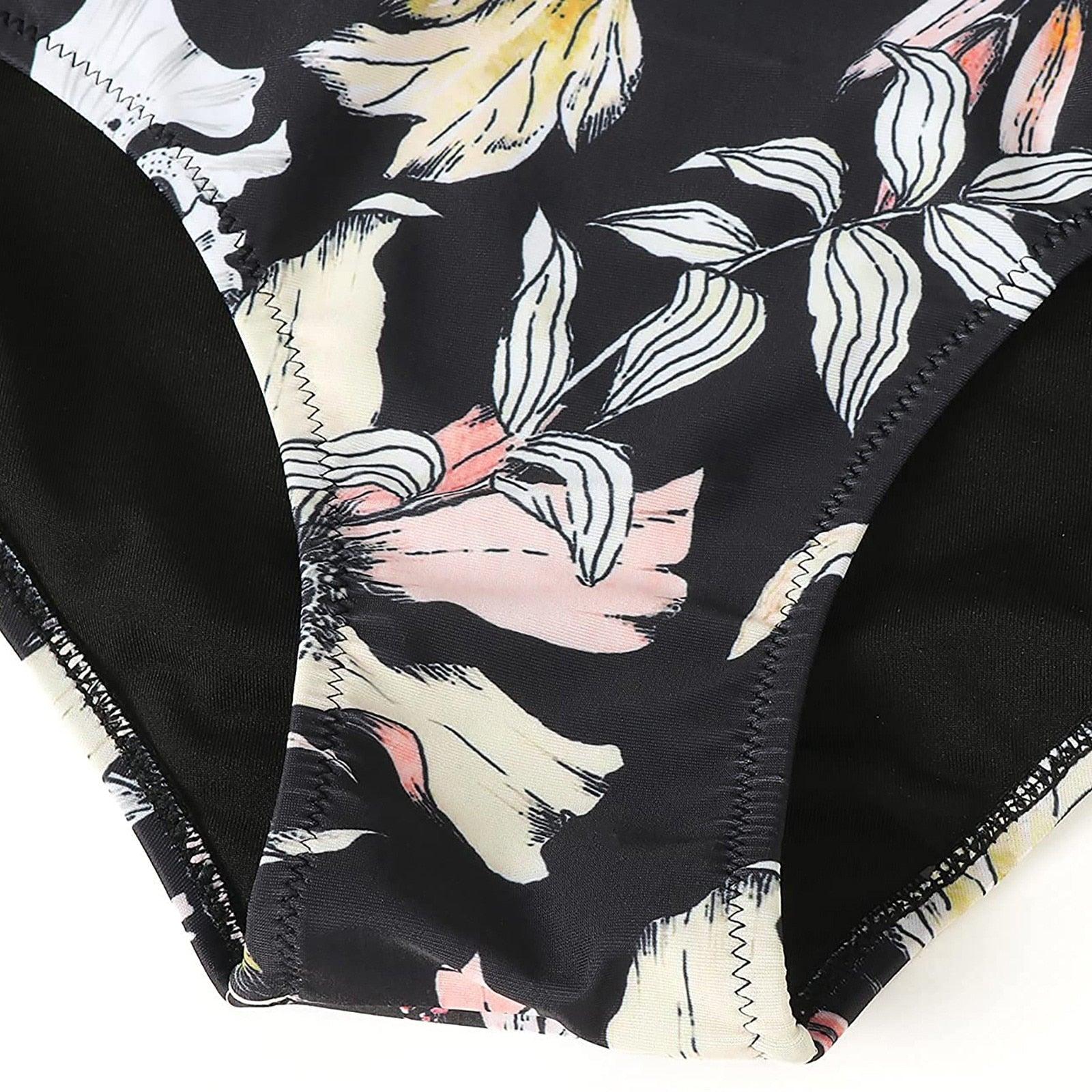Stevvex floral 2-piece bikini set with high waist, crisscross design, string ties, and colorful flower print for summer swimming.