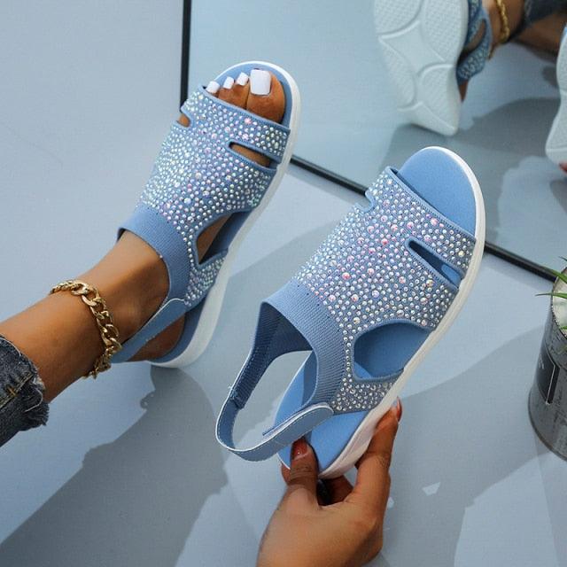 Blue Stevvex women's summer sandals with buckle strap, open toe, slip-on flat, casual beach shoe, modern square slide design.