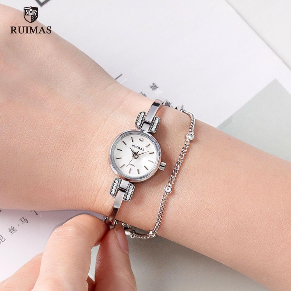 Silver women's wristwatch by Stevvex featuring a modern bracelet design, mini round face, quartz movement, and waterproof build.