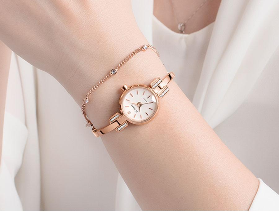 Silver Stevvex women's luxury small bracelet wristwatch with round face, modern design, quartz movement, waterproof, mini size.