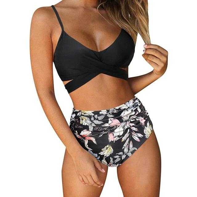 Stevvex modern floral two-piece bikini set with high waist, crisscross design, and colorful flower print for women’s summer swimwear.