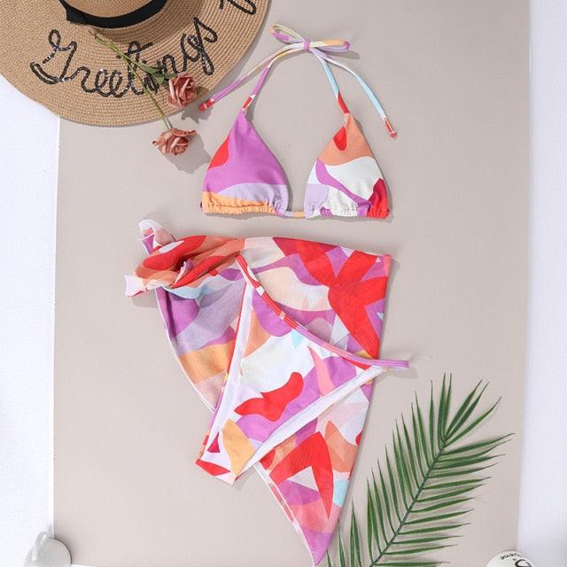 Stevvex 3-piece women's bikini set with high cut swimsuit, halter top, wrap skirt, lace-up details, and triangle backless design.
