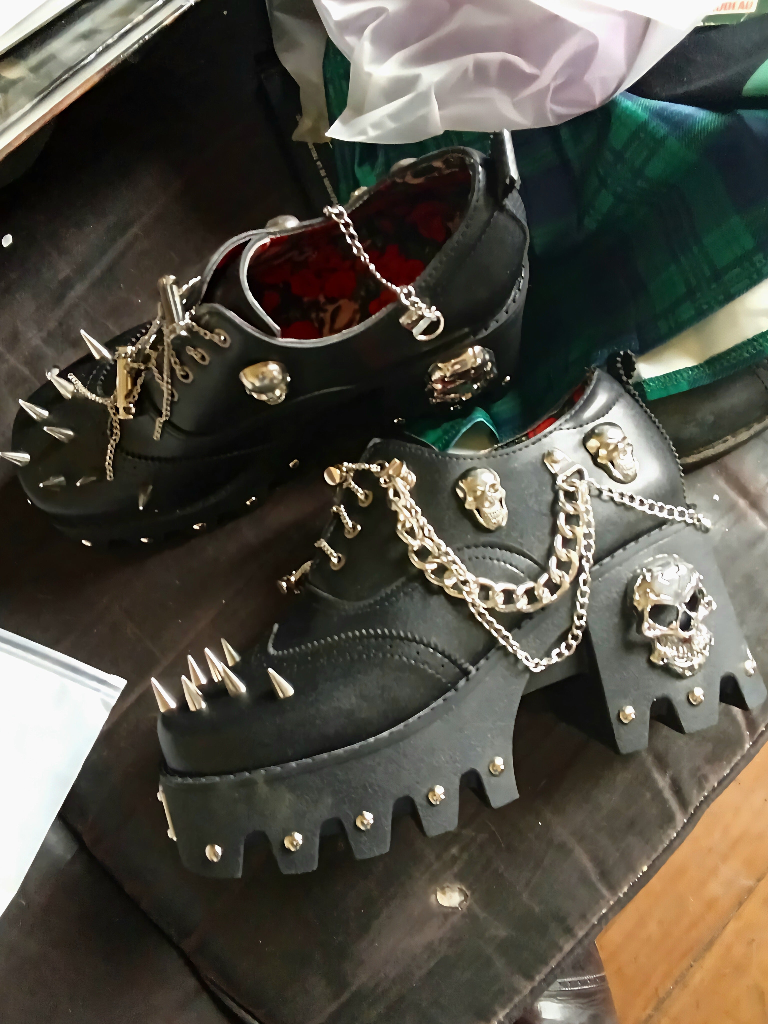 Women's skull shoes with spikes by donjohnbyvictoriacharles, featuring a bold design and edgy details on the footwear.