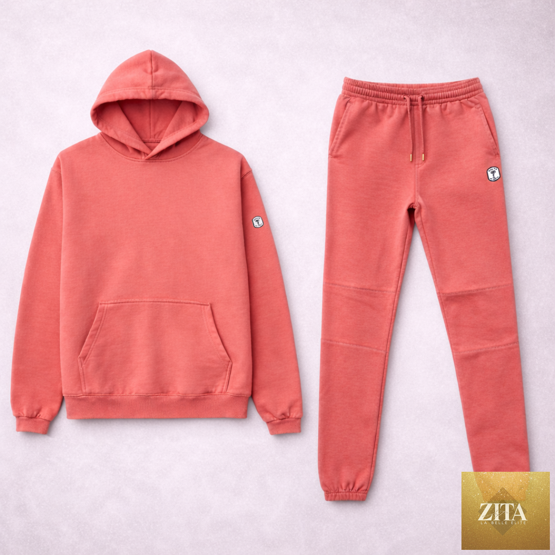 Salmon-colored women's sweatsuit set by Kinetix Casual Luxury, featuring a relaxed fit sweatshirt and matching sweatpants.