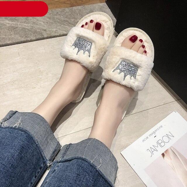 Stevvex women's faux fur indoor slippers with heart-shaped open toe design, soft memory foam, and plush fuzzy exterior.